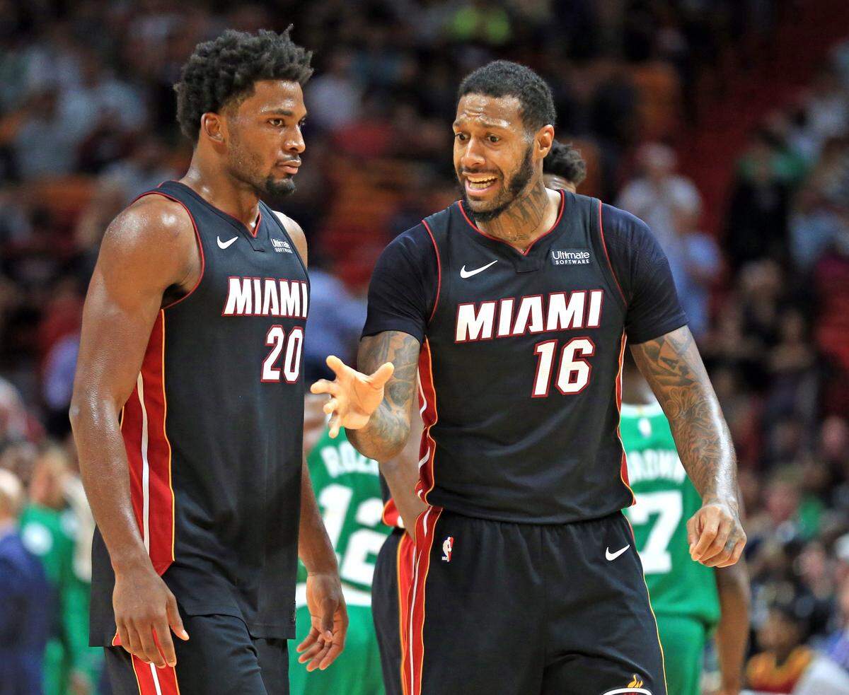 Miami Heat forward Justise Winslow (20) and forward James Johnson (16) talk at mid court as the Miami Heat host the Boston Celtics at AmericanAirlines Arena on Saturday, October 28, 2017.