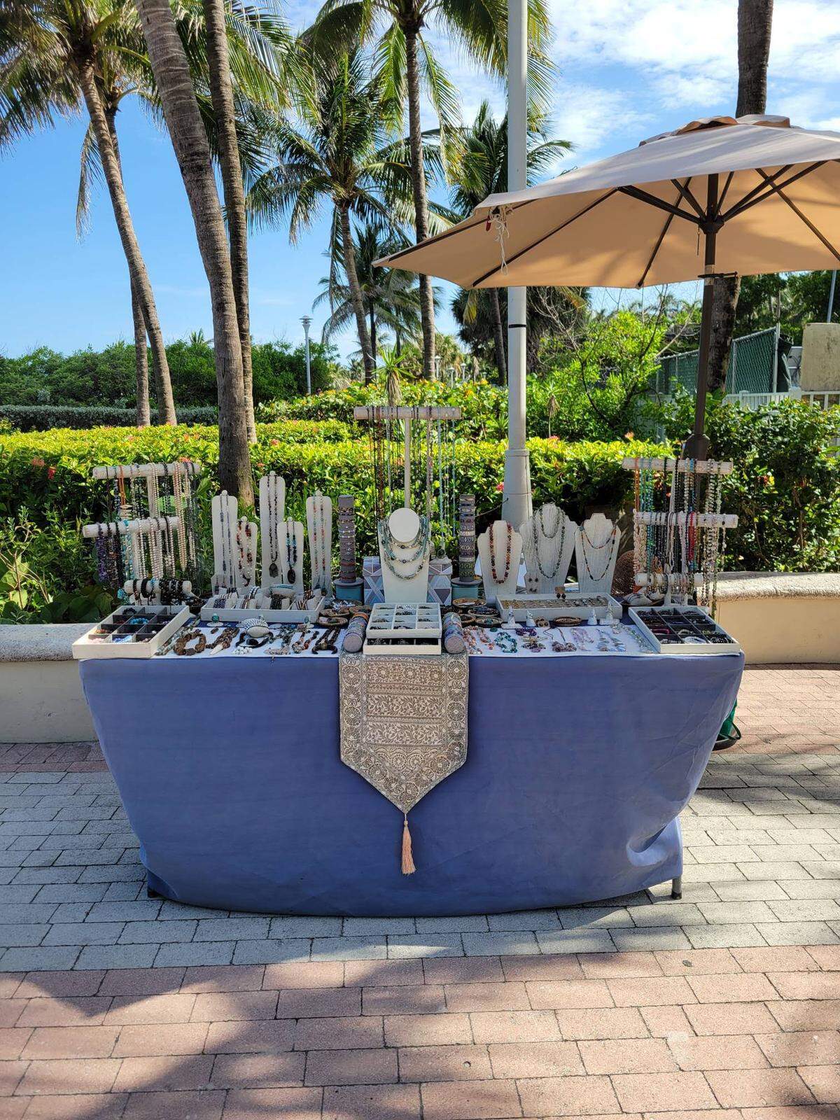 Artist Christine King displays her art along the beachwalk at 21st Street in Miami Beach in August 2024. King has been part of the city’s artist vendor program since 2016.