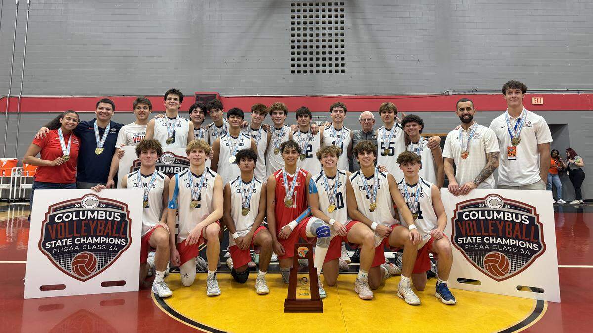 The Columbus volleyball team celebrates after winning their its first state championship following a 3-set win over Horizon High on Saturday at Polk State College in Winter Haven, Fla.