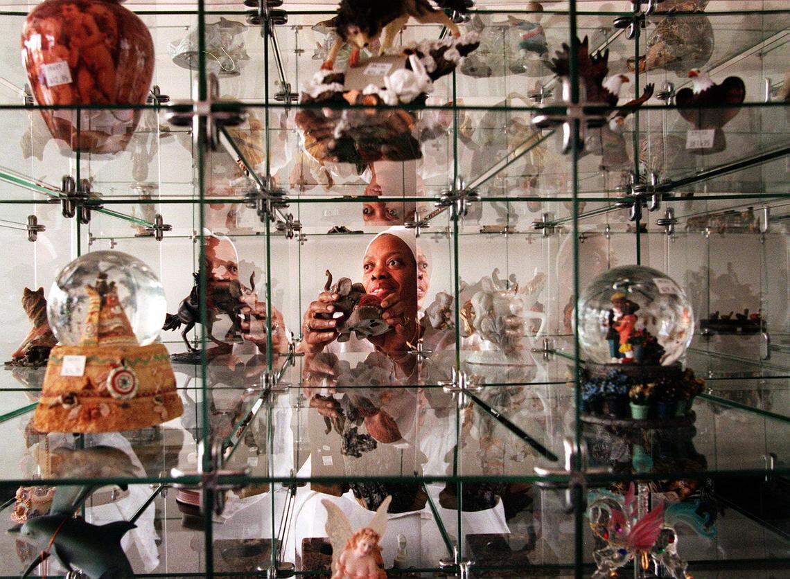 Kebar Ben Yahweh with a display of the specialty gift items which she is selling from The Yahwehs International World of Products at 821 Homestead Blvd in Homestead. The store opened Saturday in a shopping center whose other tenants include Publix and Blockbuster.