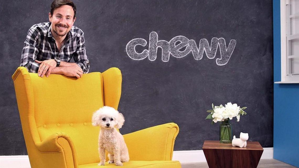 Ryan Cohen, CEO of Chewy.com, and his pet poodle Tylee pose for a portrait at their headquarters photo studio in Dania Beach on Feb. 1, 2017. Cohen sold Chewy to PetSmart in 2017, and left Chewy in 2018. 