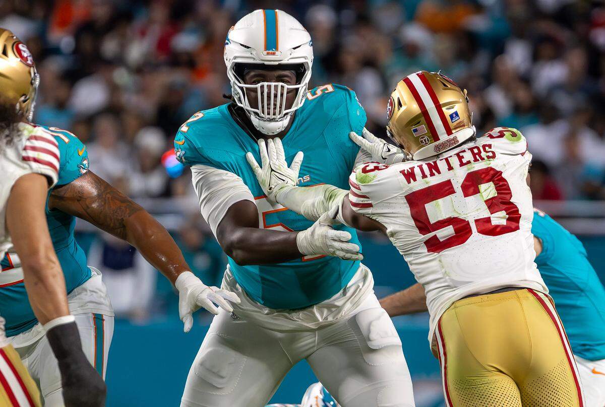 Miami Dolphins offensive tackle Patrick Paul (52) blocks San Francisco 49ers linebacker Dee Winters (53) during the second half of an NFL game at Hard Rock Stadium on Sunday, Dec. 22, 2024, in Miami Gardens, Florida.