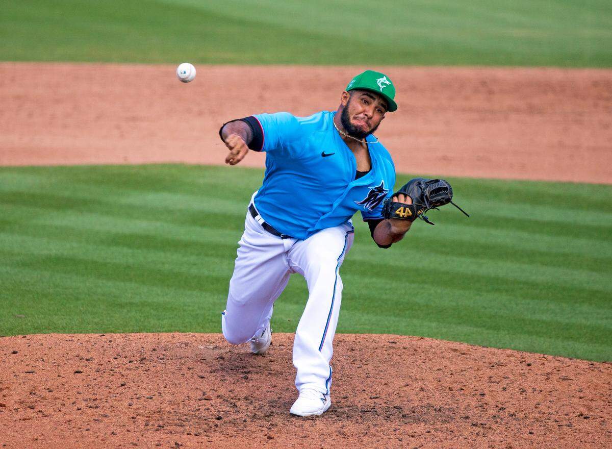 Miami Marlins pitcher Yimi Garcia (93) pitches against the New York Mets during the eighth inning of their spring training baseball game at Roger Dean Chevrolet Stadium on Wednesday, March 17, 2021 in Jupiter, Florida.