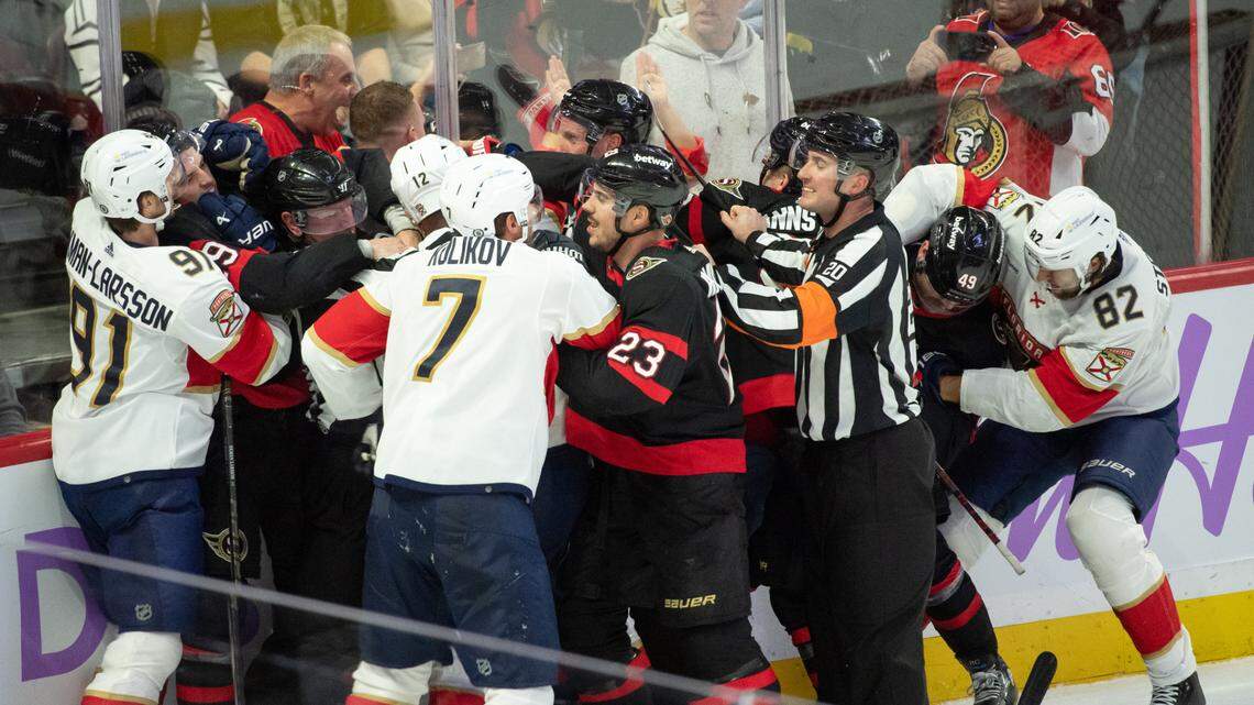 Nov 27 2023; Ottawa, Ontario, CAN; The entire Florida Panthers line including defensemen Oliver Ekman-Larsson (91) and Dmitry Kulikov (7) fight with the Ottawa Senators line which includes defenseman Travis Hamonic (23) and defenseman Erik Brannstrom (26) in the third period at the Canadian Tire Centre.
