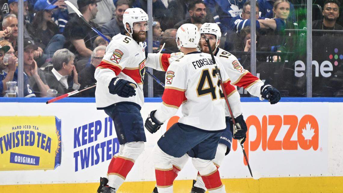 Florida Panthers defenseman Aaron Ekblad (5) celebrates with defenseman Gustav Forsling (42) and forward Matthew Tkachuk (19) after scoring a goal against the Toronto Maple Leafs in the first period in game five of the second round of the 2023 Stanley Cup Playoffs at Scotiabank Arena in Toronto, Canada, on May 12, 2023.