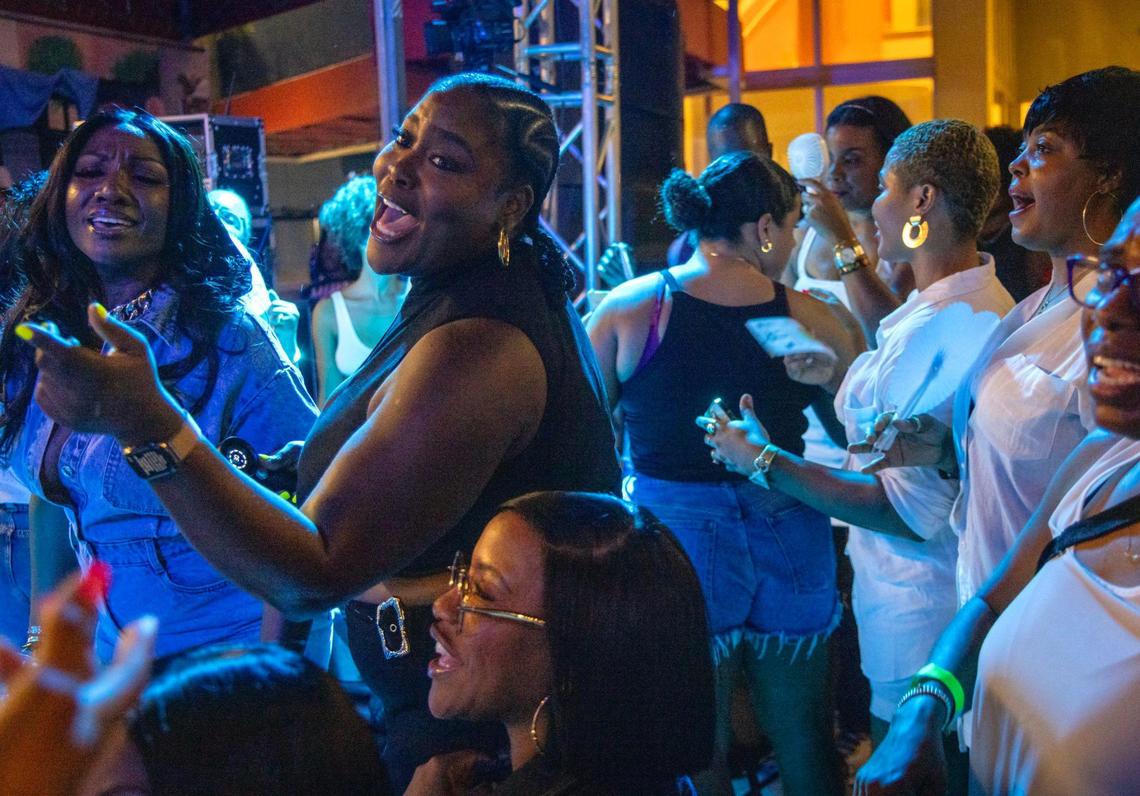 A group of women sing and dance in the VIP section as Haitian konpa star Richard Cave and his band KAI delivered another electrifying performance on Friday, June 20, 2025, at “Sounds of Little Haiti” in Miami, Florida.