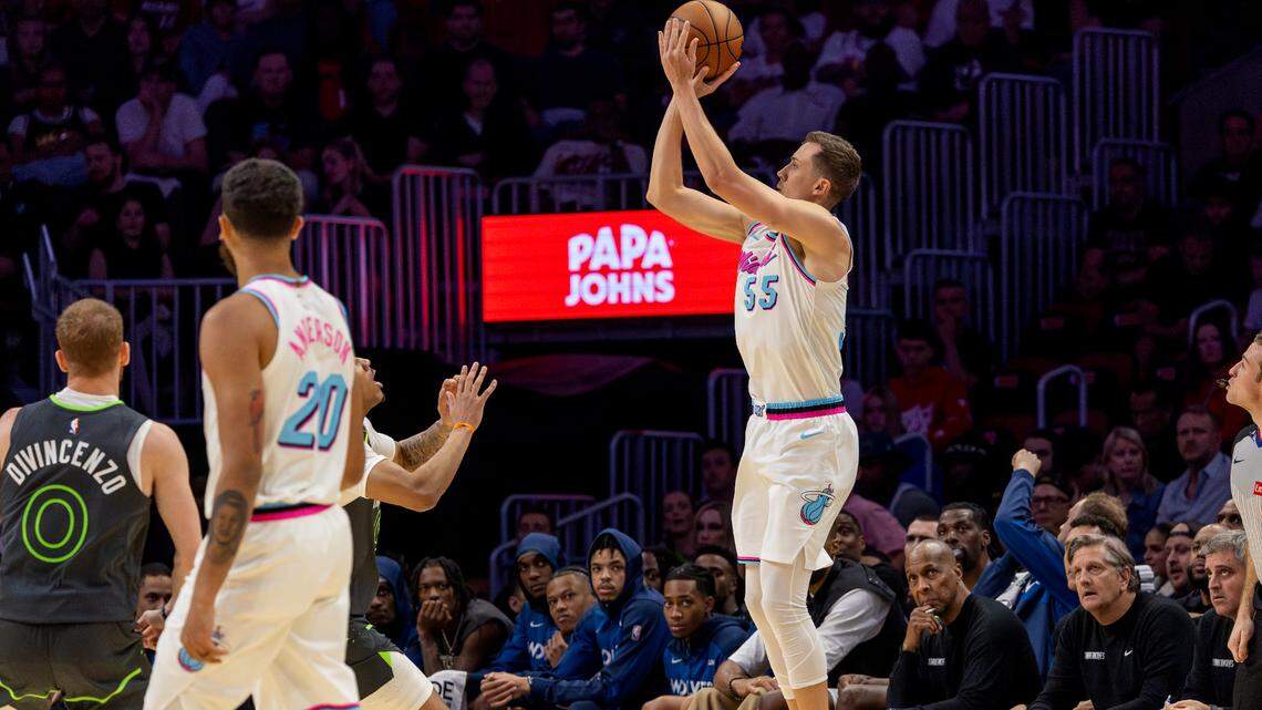Miami Heat forward Duncan Robinson (55) drains a three-pointer during the first half of their game against the Minnesota Timberwolves at Kaseya Center on March 7, 2025, in Miami.