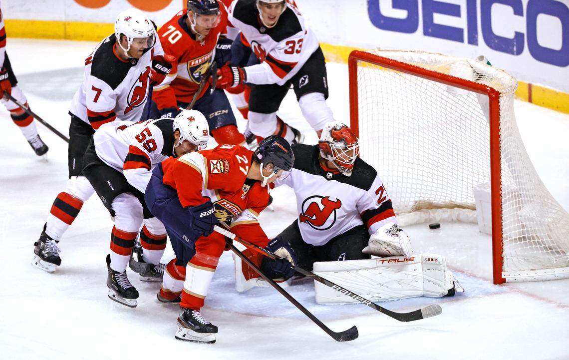 Florida Panthers center Eetu Luostarinen (27) scores a goal against New Jersey Devils goaltender Mackenzie Blackwood (29) during the second period of an NHL game at the FLA Live Arena on Thursday, November 18, 2021 in Sunrise, Fl.