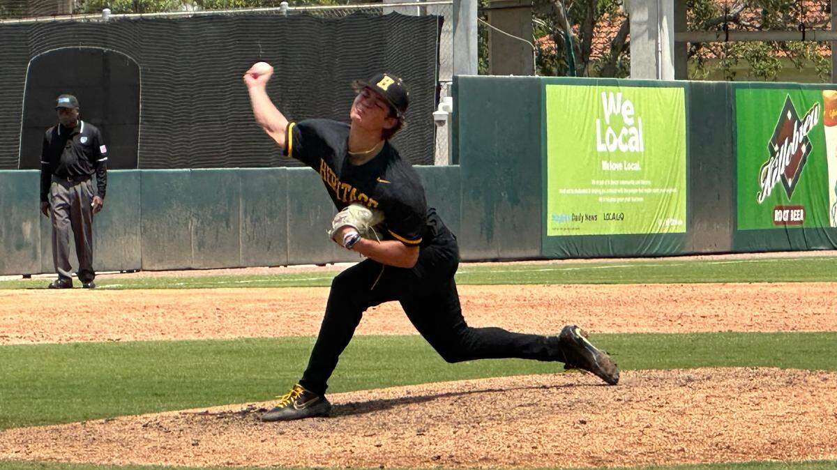 American Heritage pitcher Talan Holiday fires a pitch to the plate during Monday’s 5-2 win over Lake City Columbia in the Class 5A state semifinals at Hammond Stadium in Fort Myers.