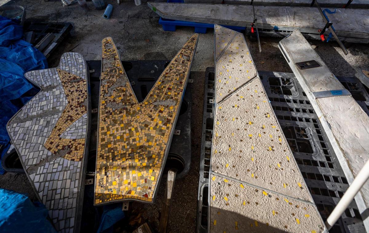 Sections of a monumental 1950s mosaic mural that was rescued from destruction in 2015 by Miami Beach preservationists sit under a tarp at Wynwood’s Bakehouse Art Complex, where the artwork is undergoing restoration. The mural by artist Jack Stewart depicts the Greek god Apollo and his mother and sister. It will be reinstalled at a new South Beach fire station.