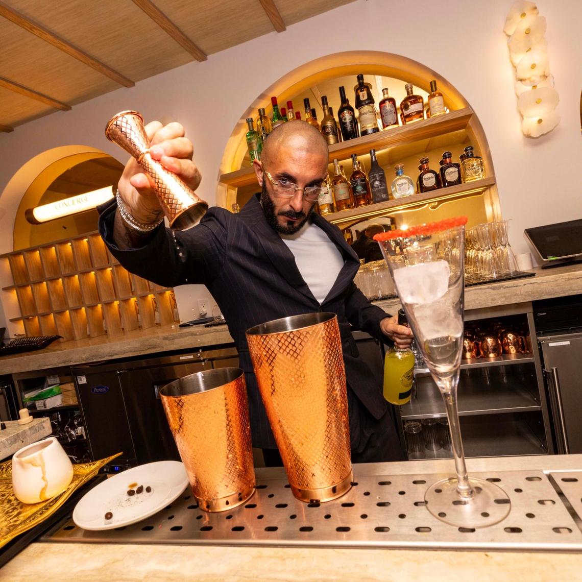A bartender makes a cocktail inside the bar at Donatella on Thursday, May 1, 2025, in Miami Beach, Fla.