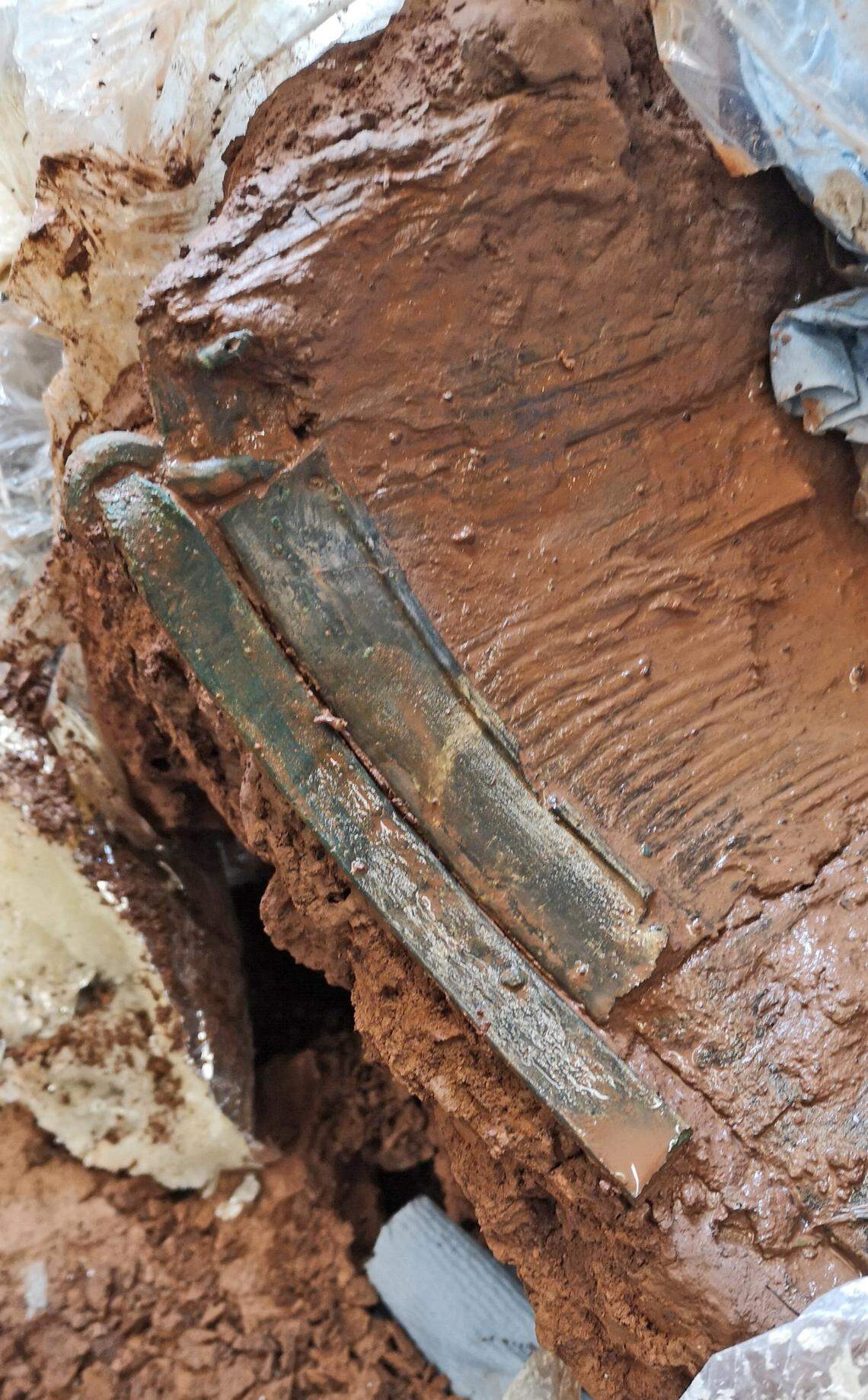 An Iron Age wooden bucket with copper fittings.