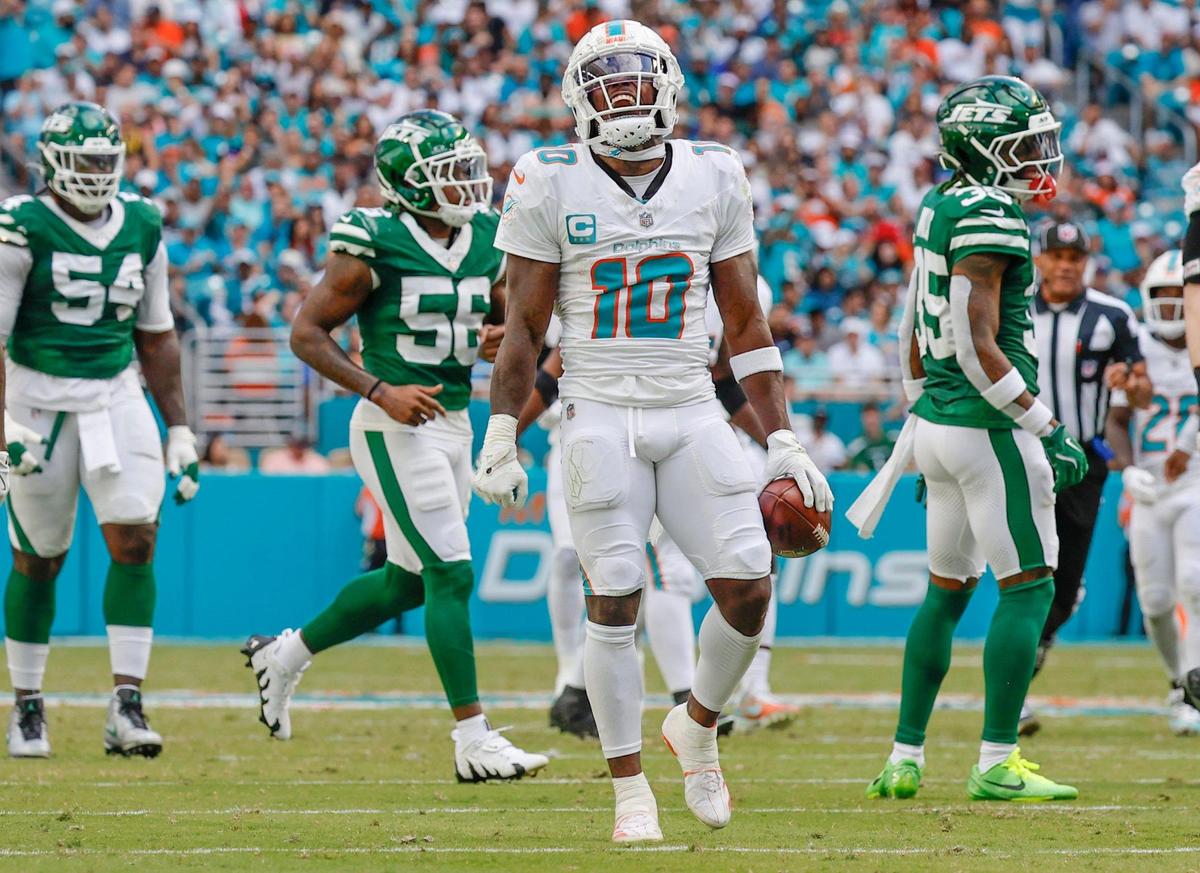 Miami Dolphins wide receiver Tyreek Hill (10) reacts after earning a first down reception against the New York Jets in the first half of their NFL football game at the Hard Rock Stadium in Miami Gardens, Florida on Sunday, December 8, 2024.