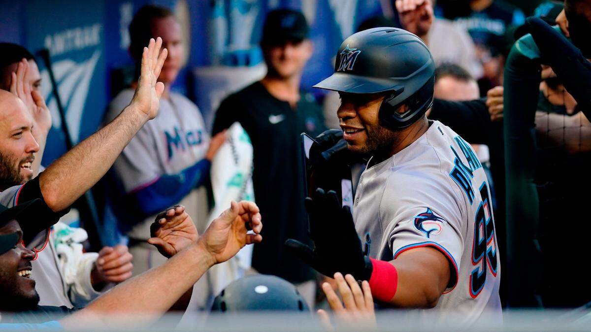 Miami Marlins’ Keith Johnson celebrates with teammates after hitting a two-run home run off Philadelphia Phillies’ Zach Eflin during the first inning of a baseball game Tuesday, June 14, 2022, in Philadelphia. (AP Photo/Matt Rourke)