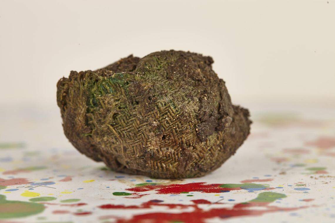 Linen envelopes holding coins were found within one of the deposits, experts said.