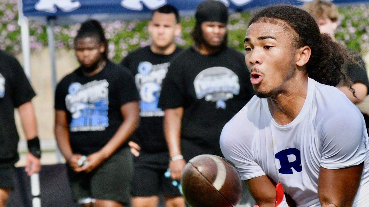 Redwood’s Israel Briggs hauls in a pass on May 1, 2025 at the first annual Redwood College Showcase at Mineral King Bowl in Visalia.