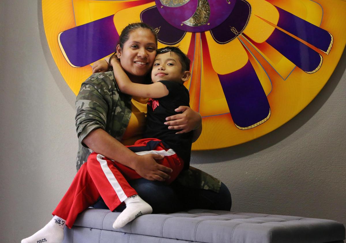 7-year-old Julian Morales hugs his mom in their Homestead home, Wednesday, Sept. 26, 2018. Julian has a rare genetic disorder and is in need of a bone marrow transplant. But finding a match has been a challenge. According to Be the Match, getting Hispanic donors isn’t easy.
