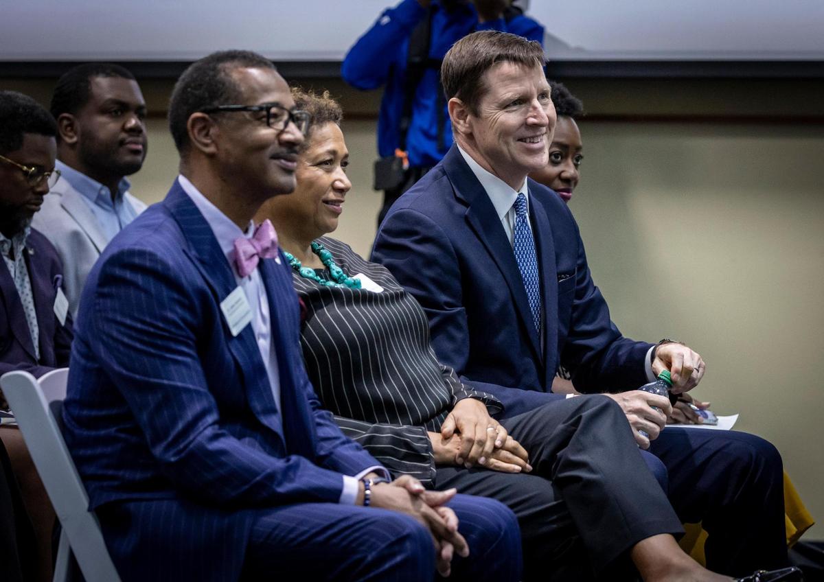 Dr. Jaffus Hardrick (left), President of Florida Memorial University; Carol Lake, JPMorgan Chase; Tim Berry, Global Head of Corporate Responsibility and Chairman of the Mid-Atlantic Region, JPMorgan Chase and Leigh-Ann Buchanan, listen to speakers during a small ceremony at Florida Memorial University where it was announced that JPMorgan Chase was donating $1million to FMU.