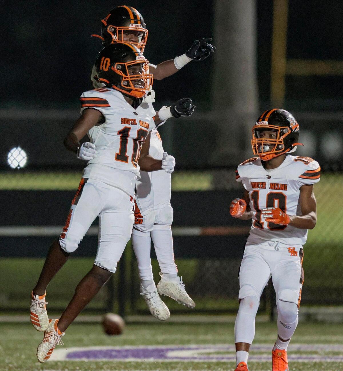 South Miami Cobras Raheem Coleman (10) celebrates his touchdown with teammates in the second quarter during game against the Homestead Broncos at Harris Field in Homestead, Florida on Friday, September 30, 2022.