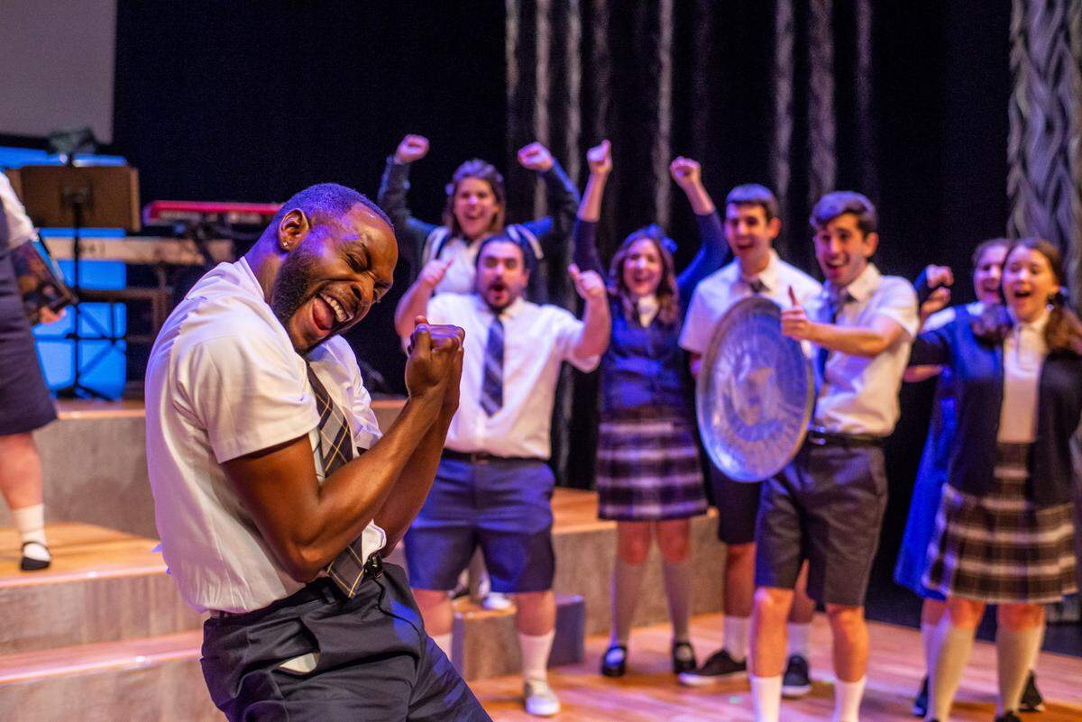 Jovon Jacobs (foreground) celebrates a little too early in ‘Chronicles Simpkins Will Cut Your Ass’ at the Summer Shorts festival.