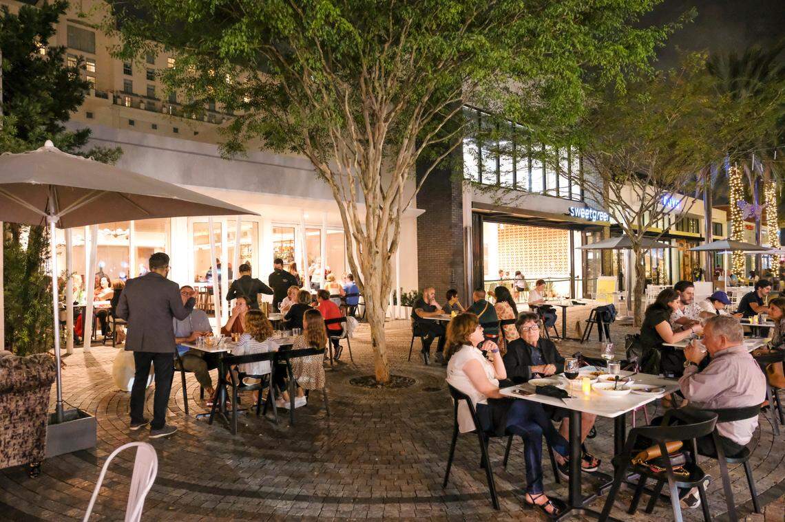 The outdoor seating area of Luca Osteria on Giralda Plaza