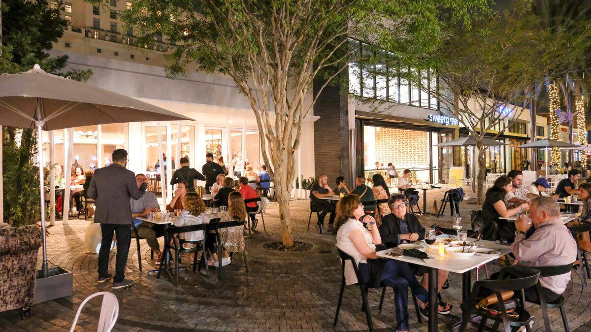 The outdoor seating area of Luca Osteria on Giralda Plaza