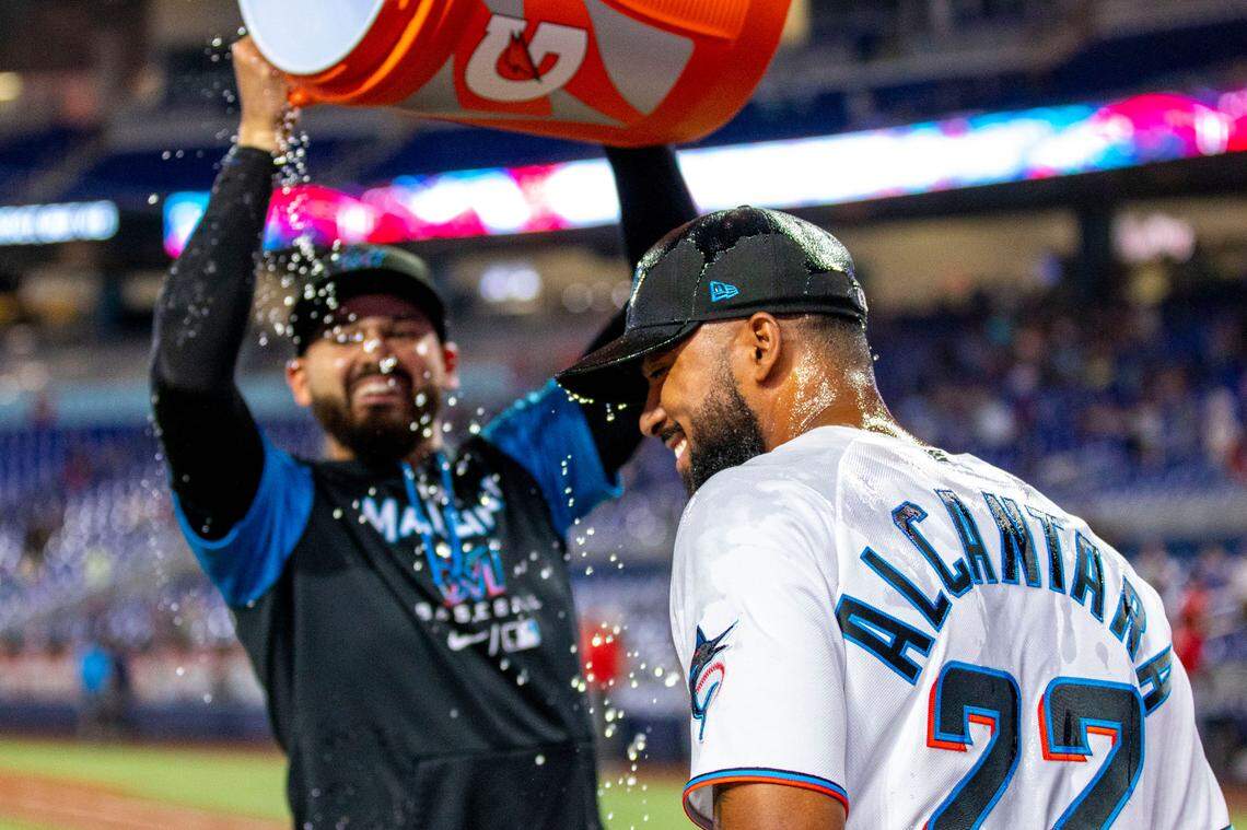 Miami Marlins pitcher Pablo Lopez (49) pours water over Sandy Alcantara (22) after the Marlins defeated the Cincinnati Reds 3-0 in nine innings of an MLB game at loanDepot park in the Little Havana neighborhood of Miami, Florida, on Wednesday, August 3, 2022.