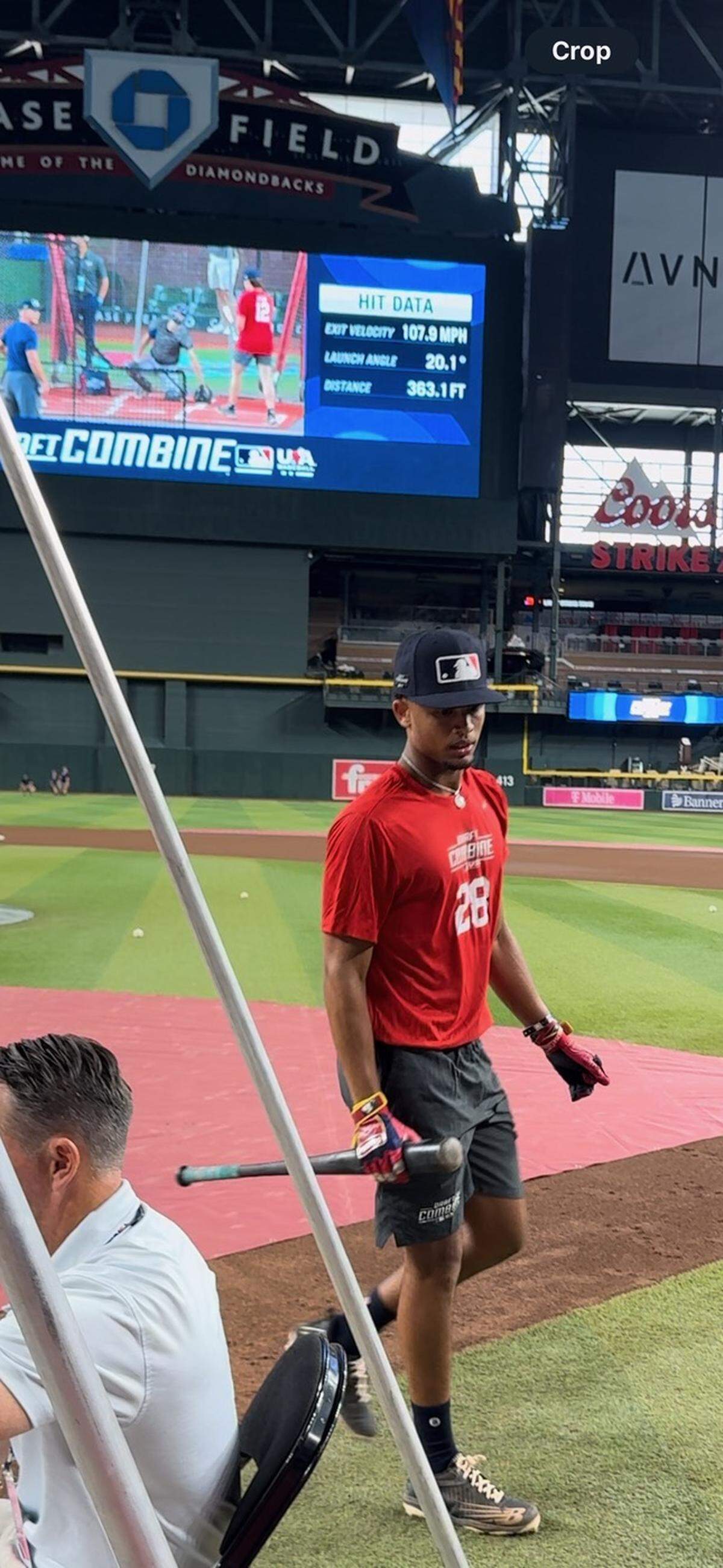 Miami Christian shortstop Ronny Cruz walks off after taking some batting practice swings at Chase Field in Phoenix, Ariz. during the MLB Draft Combine on Wednesday.