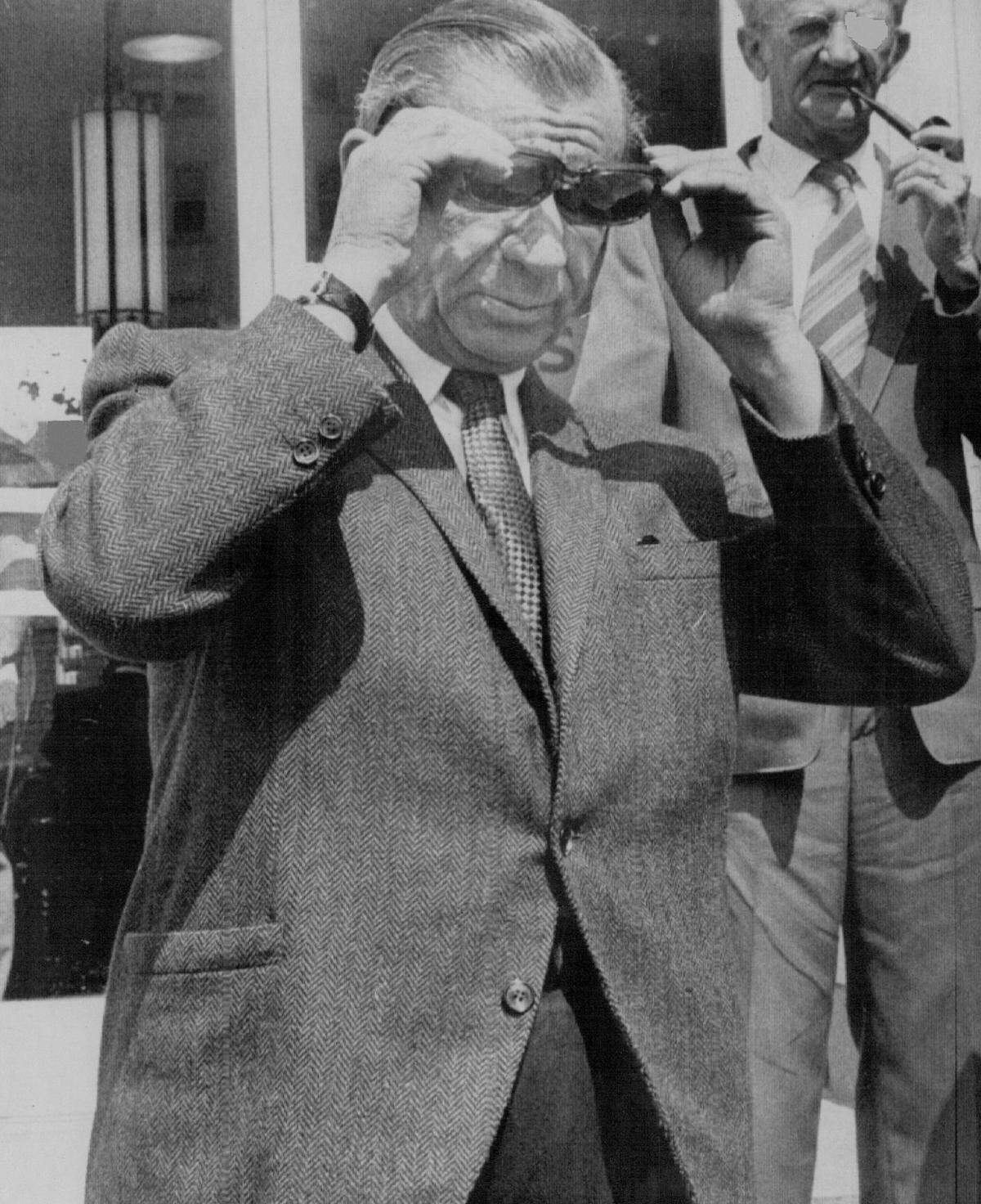 Meyer Lansky adjusts his sunglasses as he leaves the federal building in Miami in 1973. He was outside during a lunch break after a federal jury began deliberations in his trial in which he was charged with willfully disobeying a subpoena to appear before a federal jury in Miami in 1971.