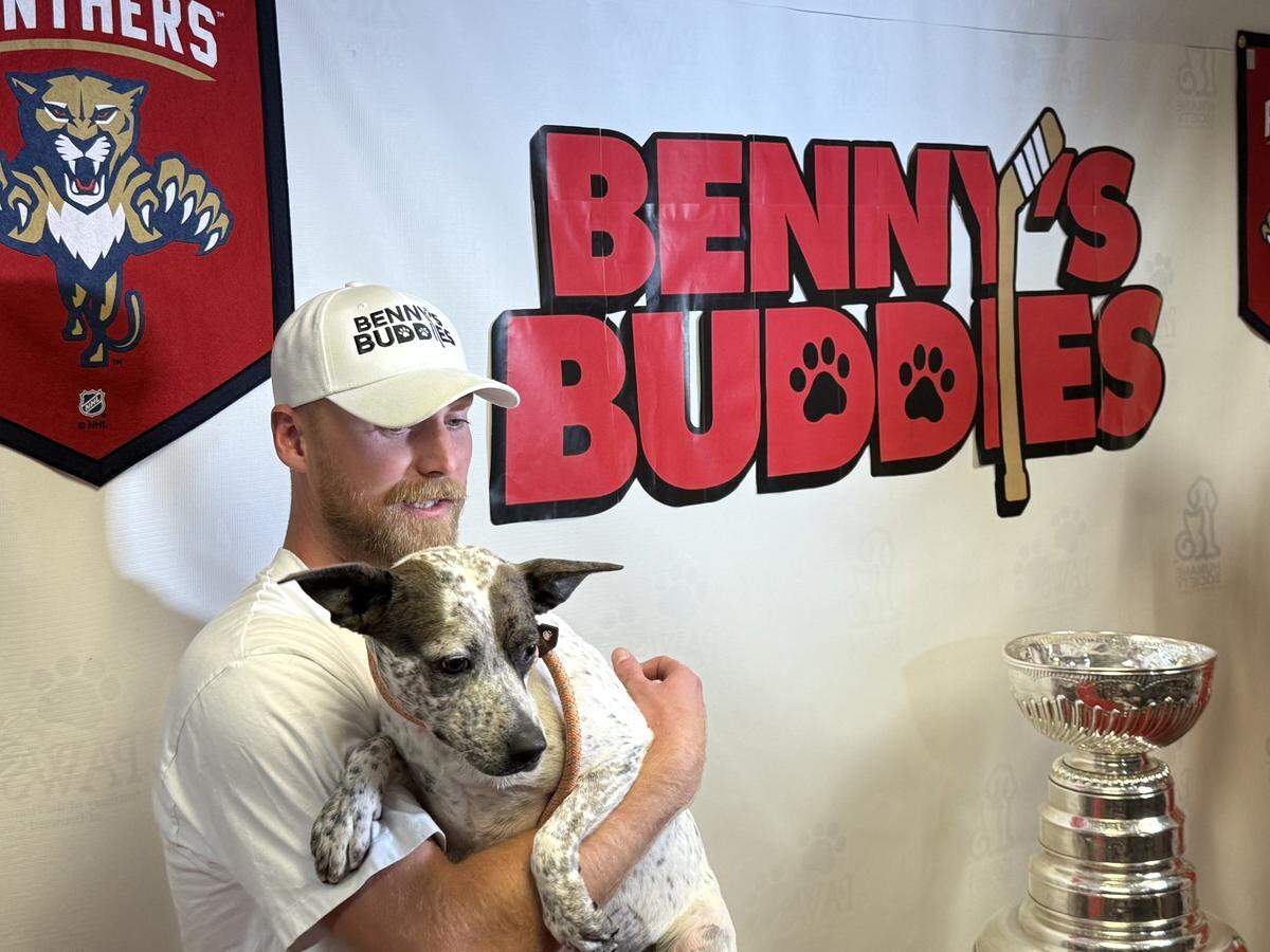 Florida Panthers forward Sam Bennett holds Kate, a 3-year-old cattle dog and one of Benny’s Buddies, at the Humane Society of Broward County on Wednesday, Sept. 10, 2025. Bennett paid the adoption fees for 41 pets at the humane society, one for every goal he scored in the 2024-25 season.