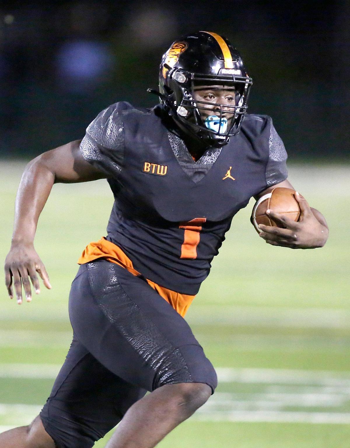Booker T. Washington Tornadoes running back Antwan Smith (1) gains yardage against Carol City Chiefs during football game on Thursday, November 10, 2022 at Traz Powell Stadium in Miami. Andrew Uloza / for Miami Herald