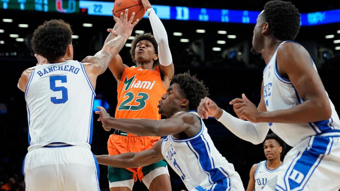 Miami’s Kameron McGusty (23) shoots over Duke’s Paolo Banchero (5) in the first half of an NCAA college basketball game during semifinals of the Atlantic Coast Conference men’s tournament, Friday, March 11, 2022, in New York. (AP Photo/John Minchillo)