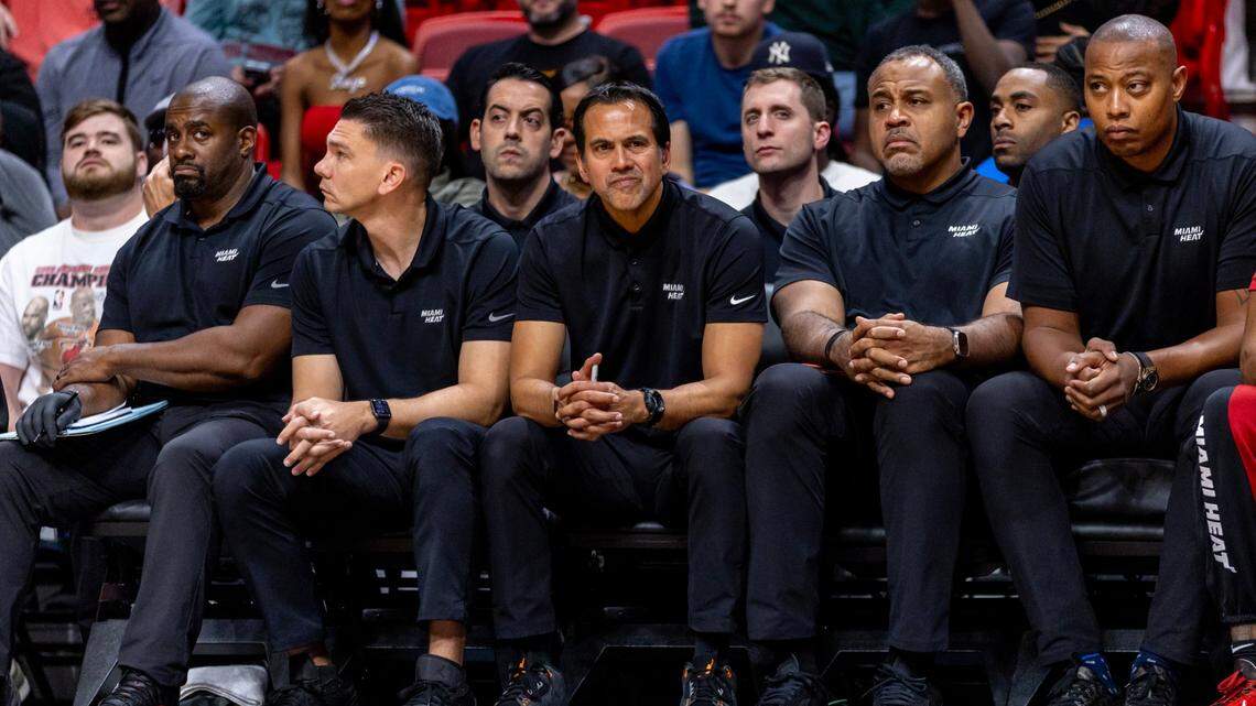 Miami Heat coach Erik Spoelstra and his coaching staff react from the bench during the second half of an NBA game against the Cleveland Cavaliers at Kaseya Center in Miami on December 8, 2023.
