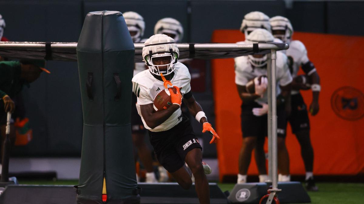 Miami Hurricanes running back Chris Johnson Jr. (24) works out during training camp at the Carol Soffer Indoor Practice Facility at the University of Miami in Coral Gables, Florida, Saturday, August 3, 2024.