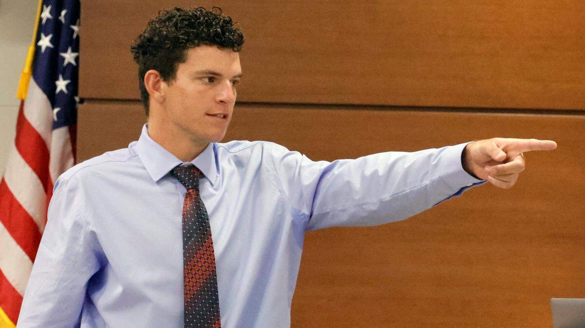 Former Marjory Stoneman Douglas student Christopher McKenna points out the defendant during the penalty phase of MSD shooter Nikolas Cruz’s trial at the Broward County Courthouse in Fort Lauderdale on Tuesday, July 19, 2022. McKenna was the first student to encounter Cruz before his rampage. Cruz previously pleaded guilty to all 17 counts of premeditated murder and 17 counts of attempted murder in the 2018 shootings. (Mike Stocker/South Florida Sun Sentinel via AP, Pool)
