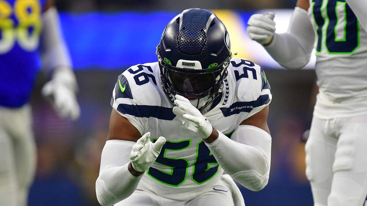 Dec 4, 2022; Inglewood, California, USA; Seattle Seahawks linebacker Jordyn Brooks (56) reacts after sacking Los Angeles Rams quarterback John Wolford (13) during the second half at SoFi Stadium. Mandatory Credit: Gary A. Vasquez-USA TODAY Sports
