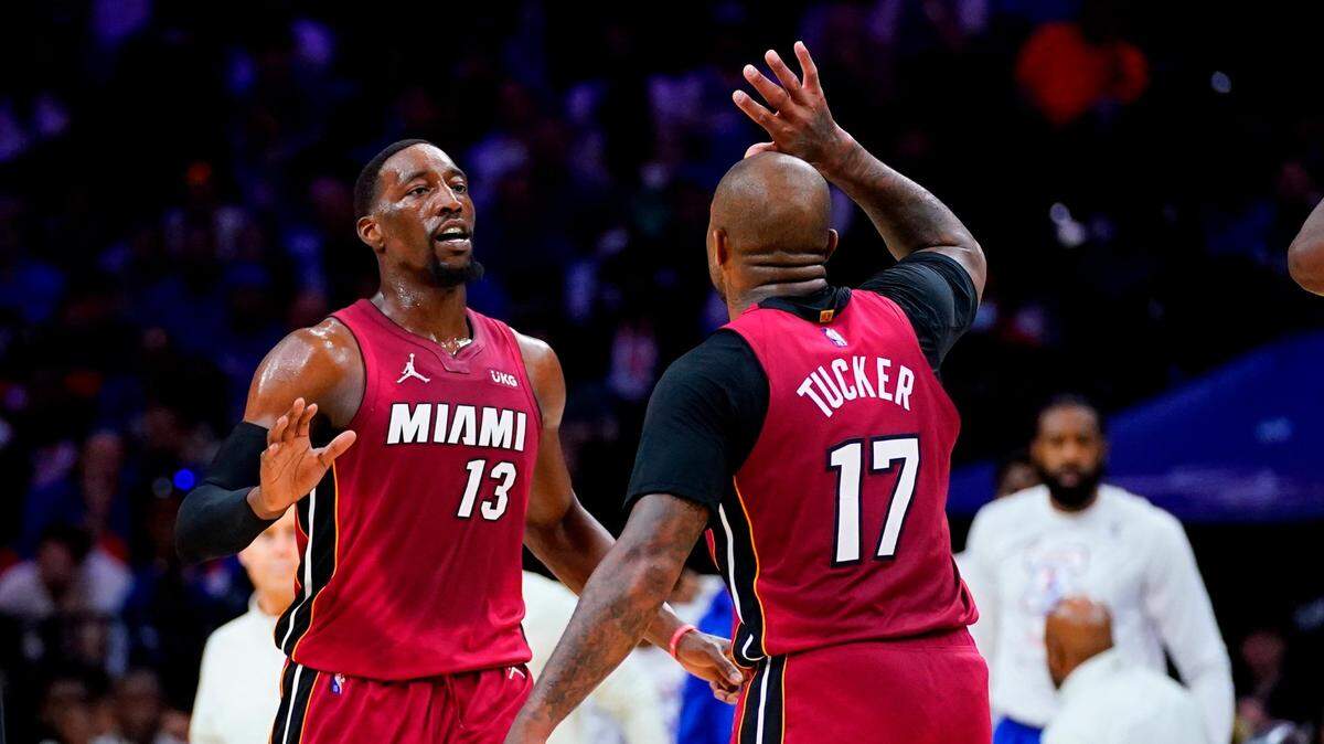Miami Heat’s Bam Adebayo (13) and P.J. Tucker celebrate during the second half of Game 6 of an NBA basketball second-round playoff series against the Philadelphia 76ers, Thursday, May 12, 2022, in Philadelphia. (AP Photo/Matt Slocum)