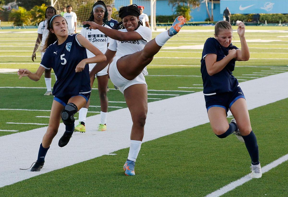 Miami Edison player hits a ball during GMAC Girls Soccer Championship game against Palmetto on Friday, January 12, 2024 at Traz Powell Stadium in Miami. Andrew Uloza / for Miami Herald