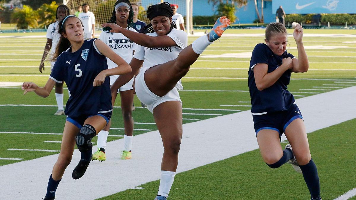Miami Edison player hits a ball during GMAC girls’ soccer championship game against Palmetto on Friday, January 12, 2024 at Traz Powell Stadium in Miami.
