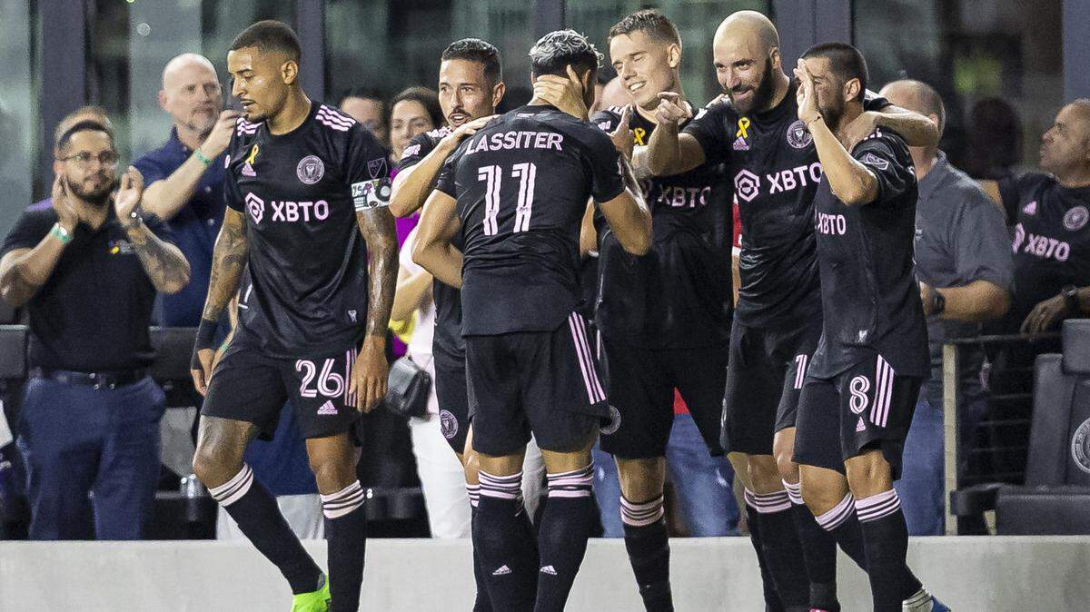 Inter Miami forward Gonzalo Higuaín (10) and forward Ariel Lassiter (11) celebrate with teammates after scoring a goal against Columbus Crew during the first half of an MLS soccer match at DRV PNK Stadium on Tuesday, Sept. 13, 2022, in Fort Lauderdale, Fla.