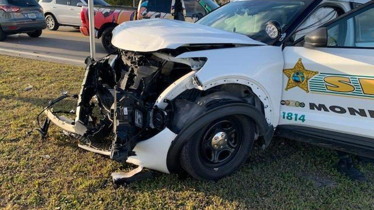 A Monroe County Sheriff’s Office car with front-end damage is parked on the side of U.S. 1 in Florida City Tuesday night, Feb. 27, 2024. The car was involved in a crash with a pickup truck. The sheriff’s office said the pickup driver pulled out in front of the deputy, who did not have time to stop.