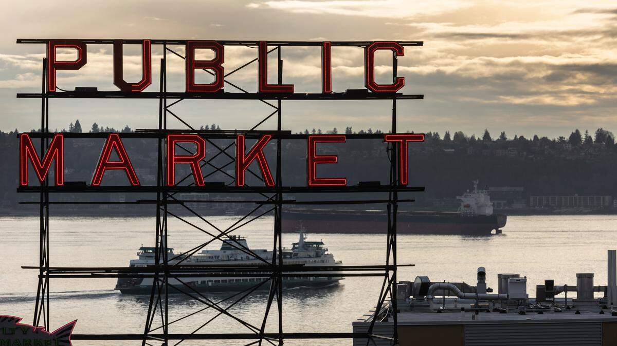 A ferry and a tanker pass through the Puget Sound near Seattle’s iconic Pike Place Market on March 11, 2022, in Seattle, Washington.