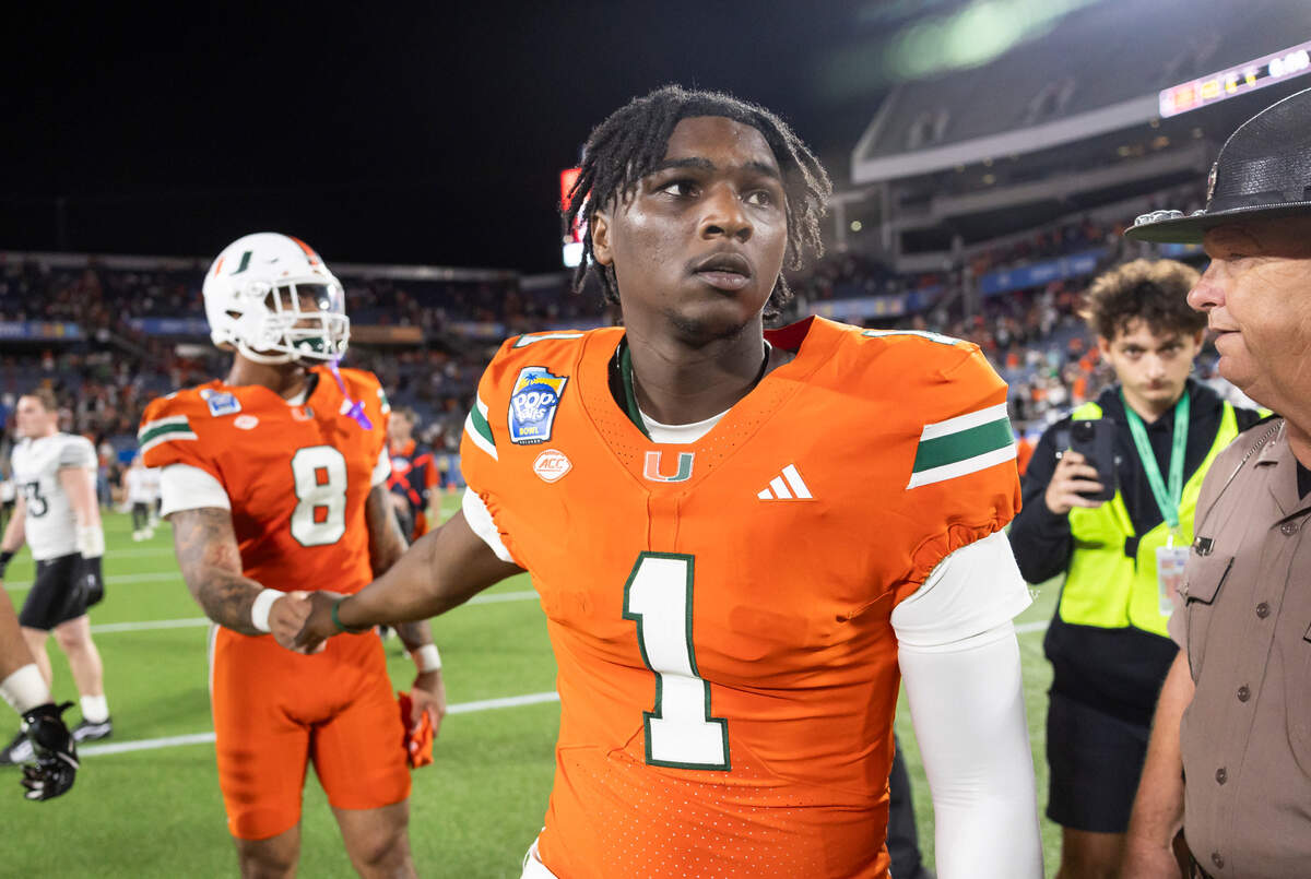 Miami Hurricanes quarterback Cam Ward (1) looks on from the field after losing to Iowa State Cyclones in their Pop-Tarts Bowl football game at the Camping World Stadium on Saturday, Dec. 28, 2024, in Orlando, Fla.
