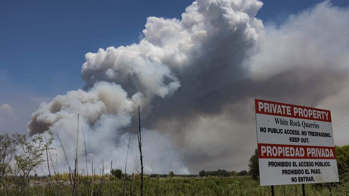 Smoke rises during a brush fire on Wednesday, June 17, 2026, in west Miami-Dade just west of Doral. The fire is 7,500 acres and 30% contained as of Wednesday afternoon.