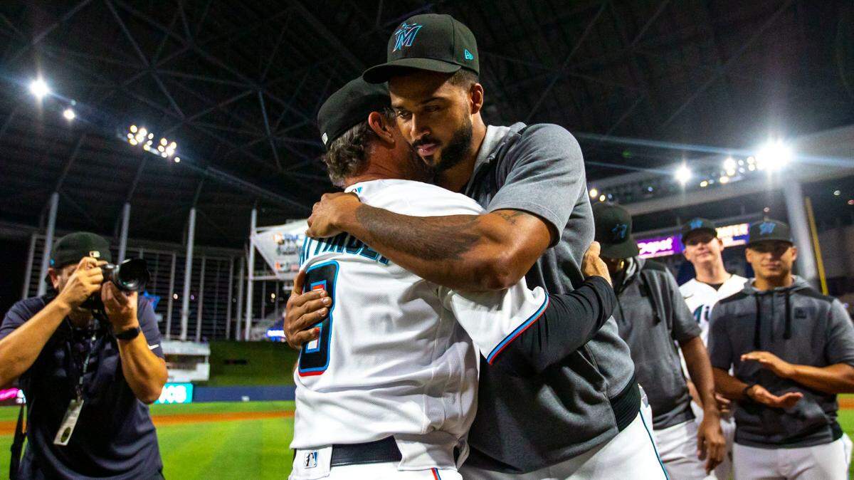 Miami Marlins manager Don Mattingly embraces pitcher Sandy Alcantara after the Marlins defeated the Braves 12-9 during his final MLB game at loanDepot park in the Little Havana neighborhood of Miami, Florida, on Wednesday, October 5, 2022.