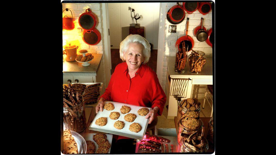 Maida Heatter, often called the country’s foremost and most famous creator of desserts and writer of dessert cookbooks, holds a tray of cookies in this Miami Herald file photo from 1995.