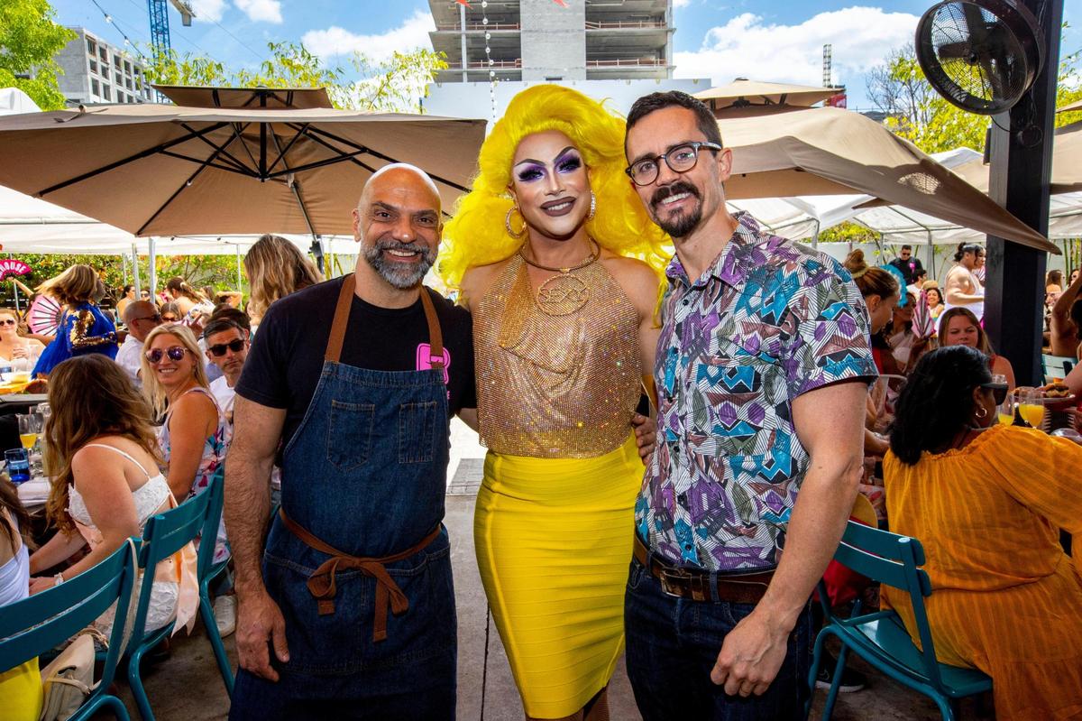 Host drag queen Athena Dion pose with co-owners/ husbands Chef Rocco Carulli (left) and Owen Bale (right) during a Drag Brunch at R House Wynwood in Miami, Florida, on Saturday, April 9, 2022.