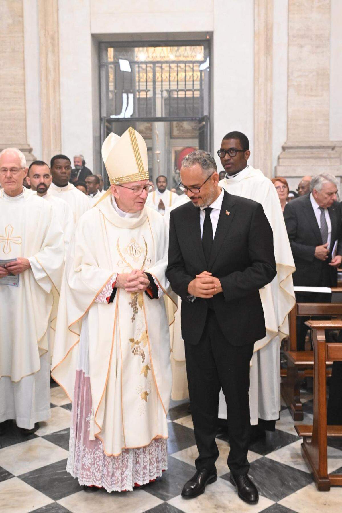 Haiti Prime Minister Alix Didier Fils-Aimé, right, attends a Mass for peace for Haiti in Rome on Saturday, May 9, 2026, after an audience with Pope Leo, not pictured.