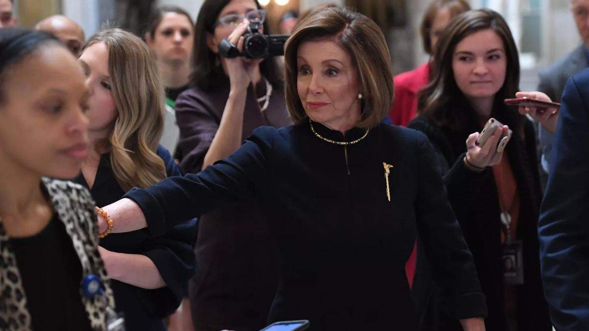House Speaker Nancy Pelosi, shown at impeachment debates in 2019, wore the same black suit for President Trump’s second impeachment.