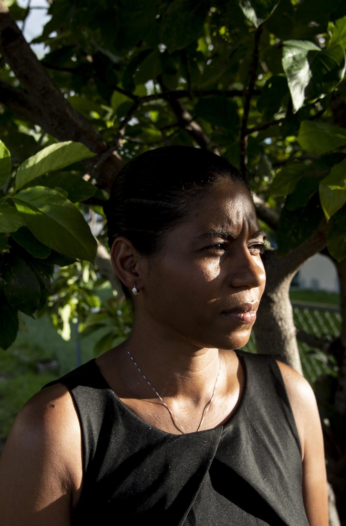 Sherry Hunt, 39, outside of her Miami home. Hunt’s personal history with domestic abuse has made her a strong advocate for a new law in Florida that allows women in abusive situations to receive unemployment benefits to help them leave their abuser without fear of financial instability.